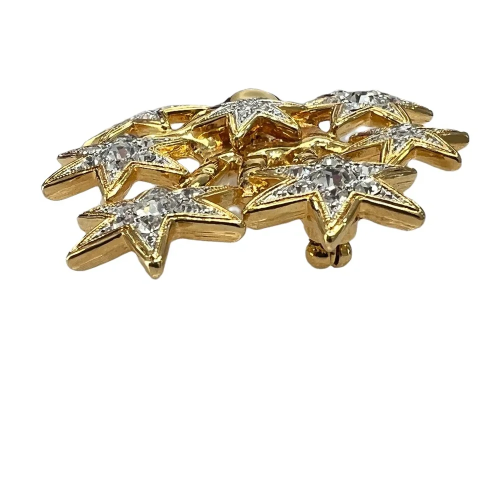 NOLAN MILLER SHINY GOLDEN HAND WITH CRYSTAL STARS BROOCH